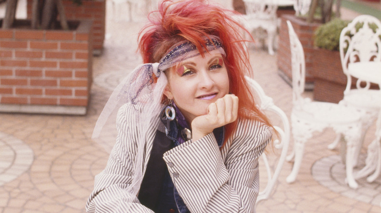 Cyndi Lauper with hand on chin