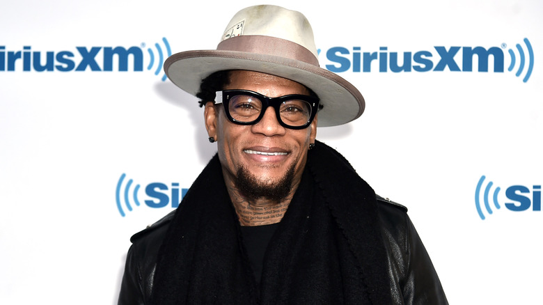 D.L. Hughley wearing glasses