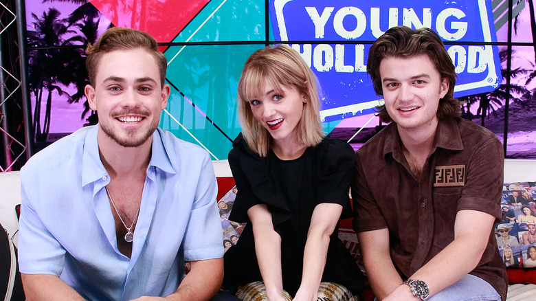 Dacre Montgomery, Natalia Dyer, and Joe Kerry posing