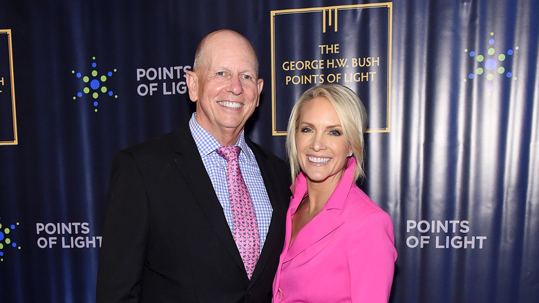 Dana Perino and husband Peter McMahon posing on the red carpet.