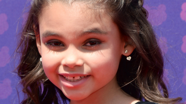 Ariana Greenblatt smiles on the red carpet