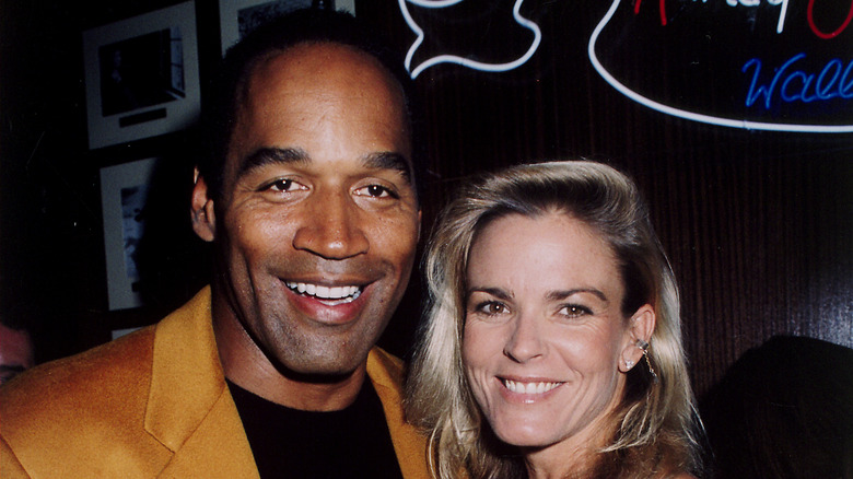 O.J. Simpson and Nicole Brown pose together 