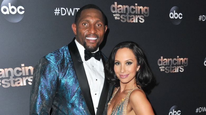 Ray Lewis, Cheryl Burke posing
