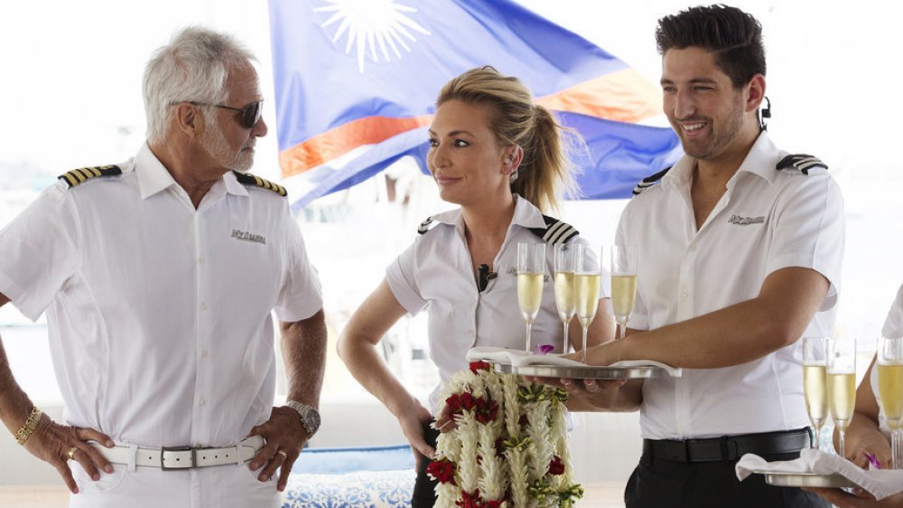 Captain Lee Rosbach, Kate Chastain, Josiah Carter smiling