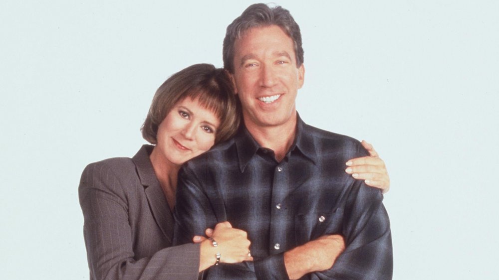 Patricia Richardson and Tim Allen posing for a Home Improvement promo shot