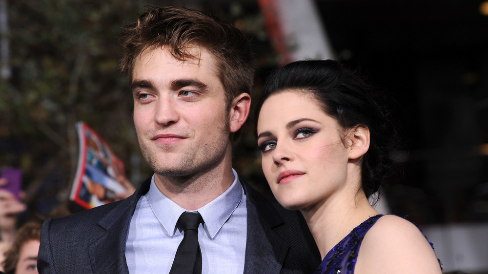 Robert Pattinson and Kristen Stewart grinning