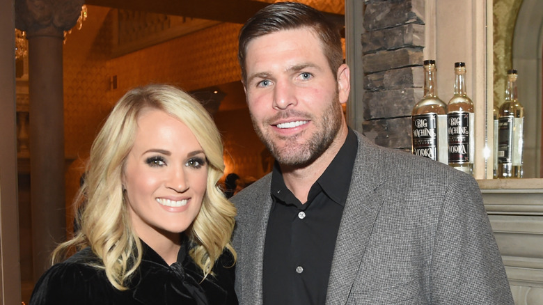 Carrie Underwood and Mike Fisher smiling
