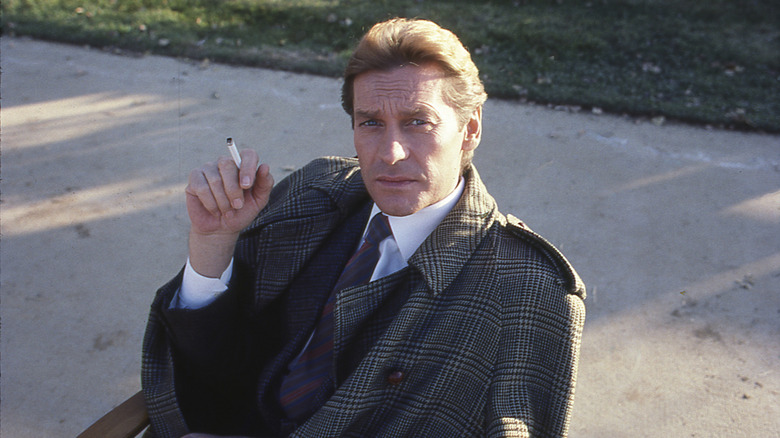 Helmut Berger taking break during filming of Dynasty