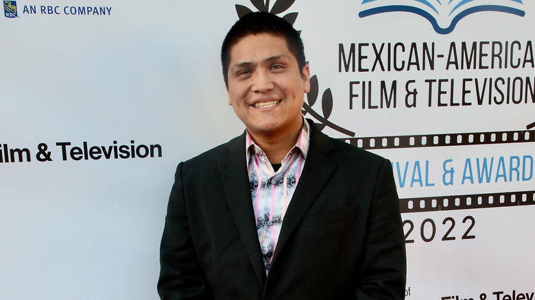 Johnny Ortiz on red carpet