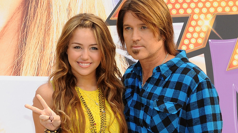 Miley and Billy Ray Cyrus pose together