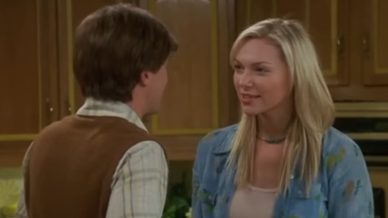 Laura Prepon with blonde hair as Donna Pinciotti