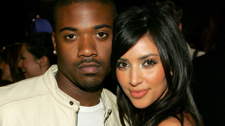 Ray J and Kim Kardashian posing