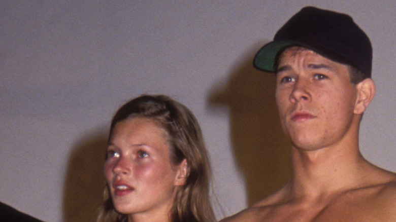 Kate Moss and Mark Wahlberg standing on stage