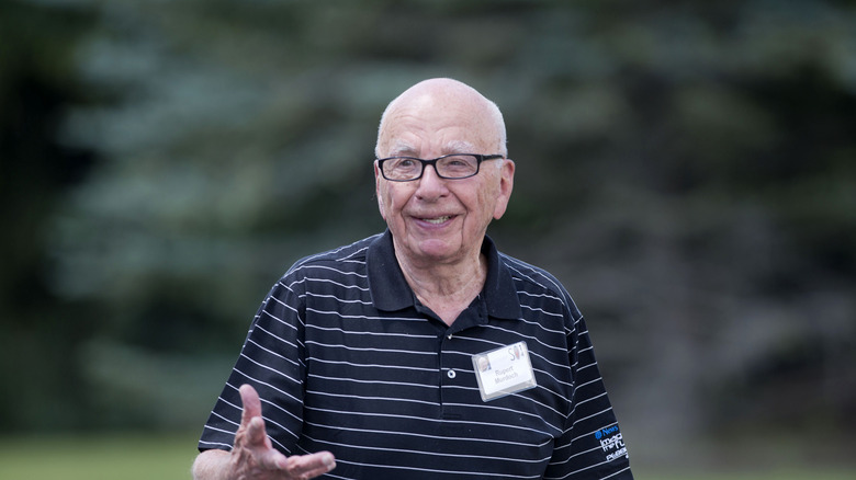 Rupert Murdoch smiling in striped shirt