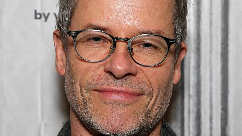 Guy Pearce in silver glasses 