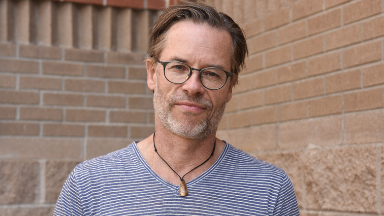 Guy Pearce in striped blue shirt