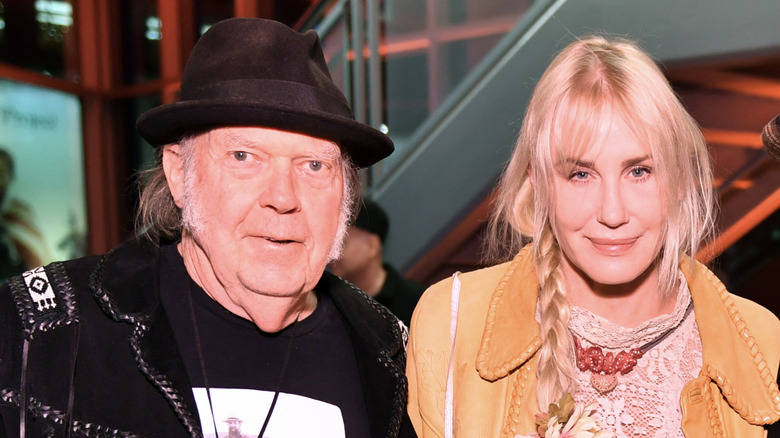 Neil Young and Daryl Hannah pose for a photo in 2023