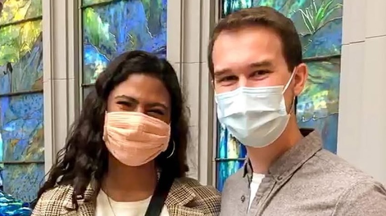 Katelynn Shennett and Jake Stille posing for cameras with masks on