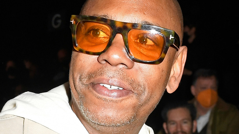 Dave Chappelle wearing large sunglasses