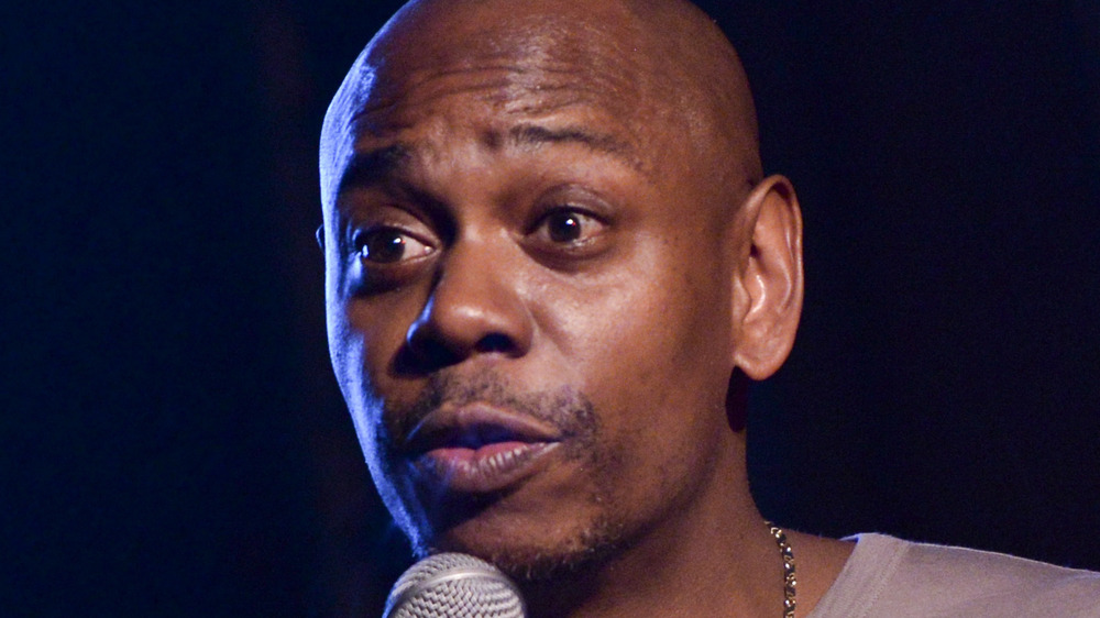 Dave Chappelle performing at an event