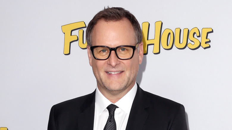 Dave Coulier poses on the red carpet