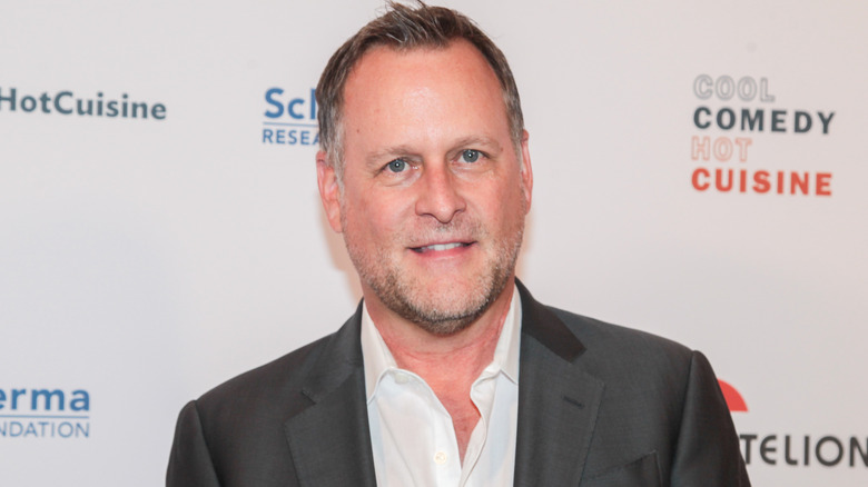 Dave Coulier posing for a photo