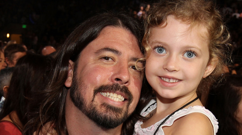 Dave Grohl holds young Violet in 2011