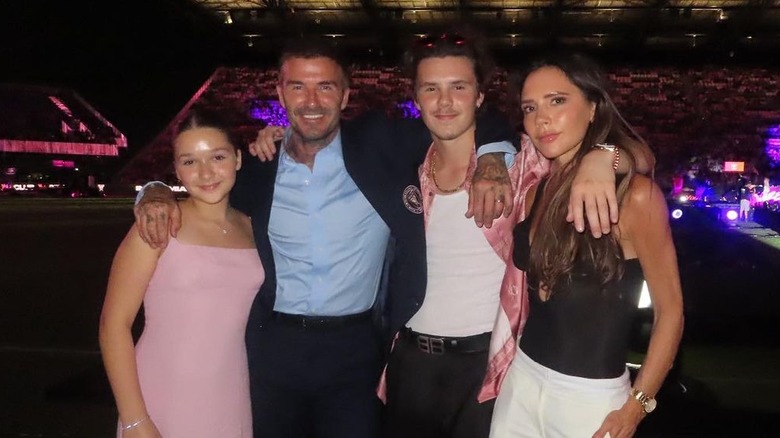 David and Victoria Beckham posing with kids