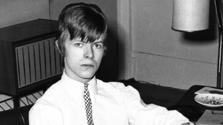 Young David Bowie looking at camera