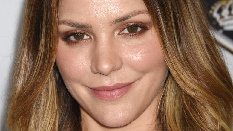 Katharine McPhee smiles with her hair down