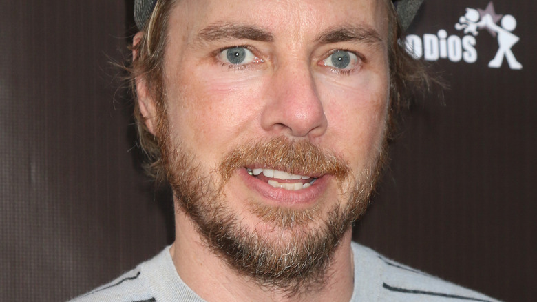 Dax Shepard with beard and slight smile