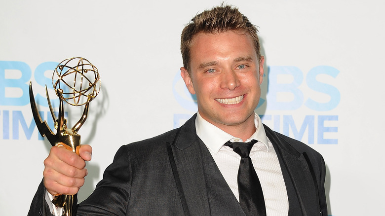 Billy Miller smiling with Emmy