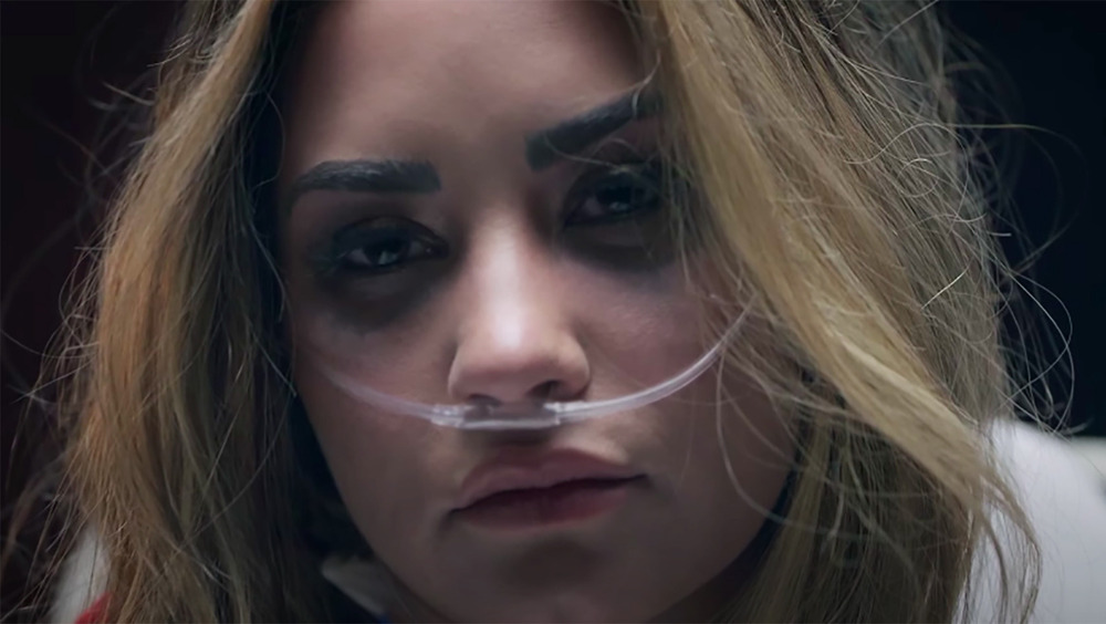 Demi Lovato stars in her new music video, Dancing With the Devil