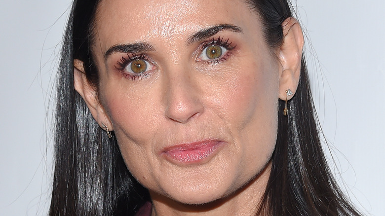 Demi Moore pursing lips