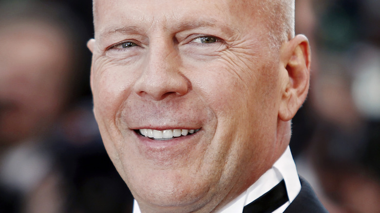 Bruce Willis smiles in a tux