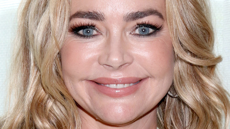 Denise Richards smiles at an event
