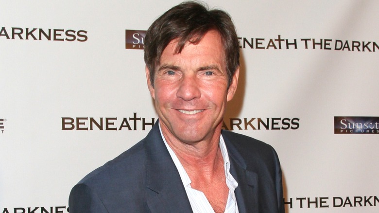 Dennis Quaid smiling at event.