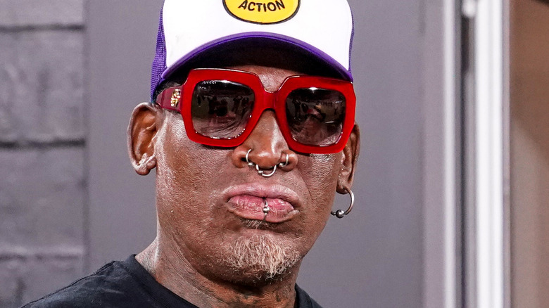 Dennis Rodman posing for cameras after a game 