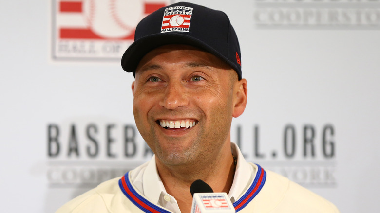 Derek Jeter smiles at the mic