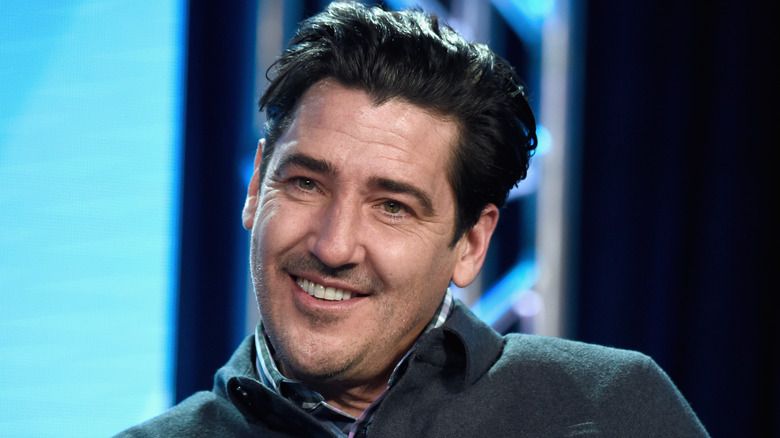 Jonathan Knight speaking on stage.