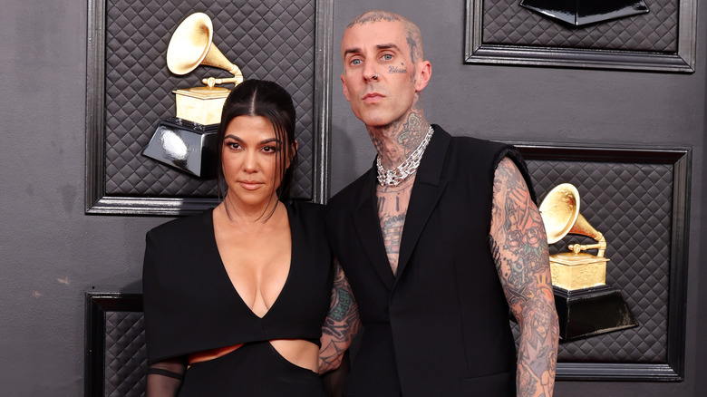 Kourtney Kardashian and Travis Barker posing