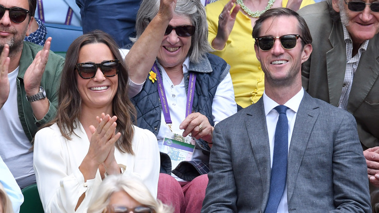 Pippa Middleton and James Matthew smiling at Wimbledon.
