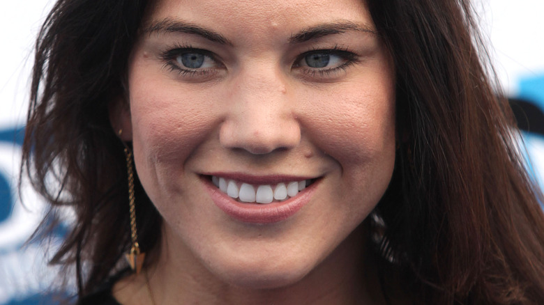 Hope Solo smiles in drop gold earrings