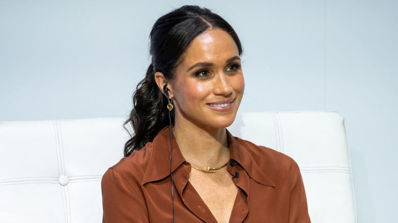 Meghan Markle seated on stage at a forum about digital responsibility at EAN University