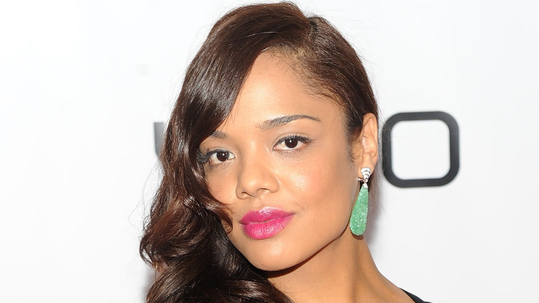 Tessa Thompson smiles on the red carpet