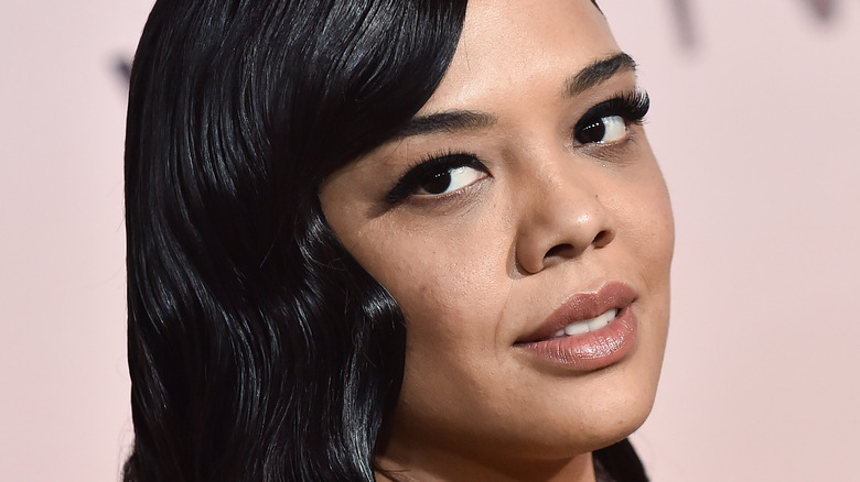 Tessa Thompson smiles on the red carpet