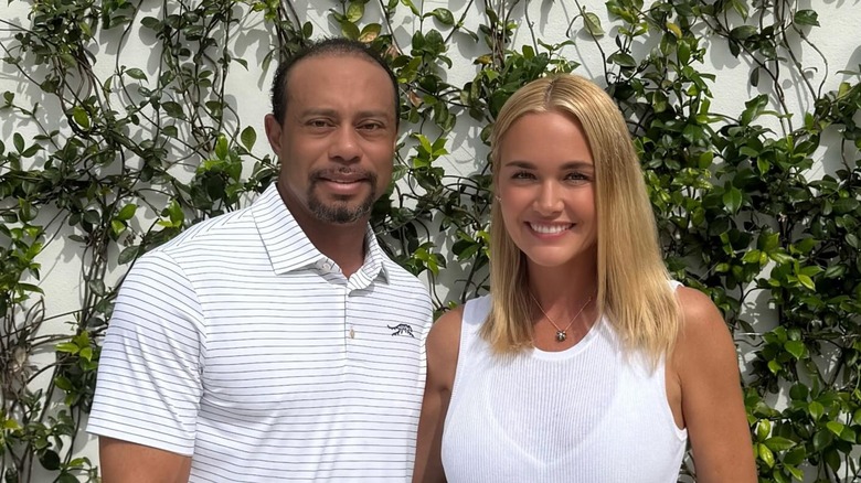 Tiger Woods smiling with Vanessa Trump