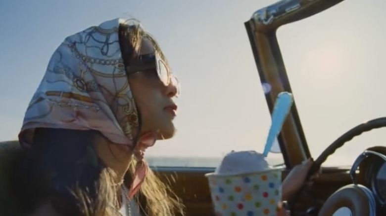 Olivia Rodrigo driving in music video for "deja vu"