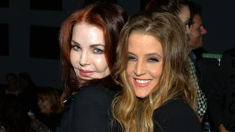 Lisa Marie Presley hugging Priscilla Presley