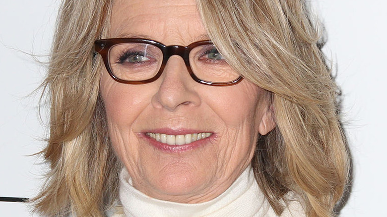 Diane Keaton poses in brown-frame glasses